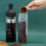 HARIO x Pac-Man crossover cold brew coffee set adding coffee beans to canister